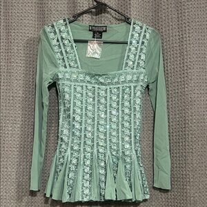 Gorgeous Long Sleeve Top with accents. Perfect for a night out.